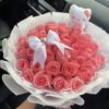 Delicate light pink bouquet and its teddy bear
