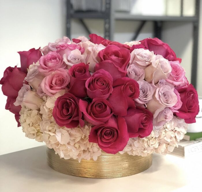 Arrangement of Pink Roses in a Ceramic Vase