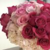 Arrangement of Pink Roses in a Ceramic Vase - Image 2