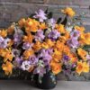 Exotic arrangement of yellow and purple roses