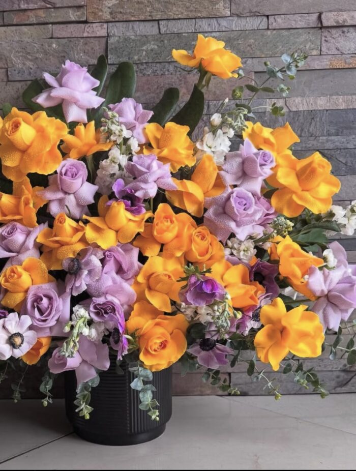 Exotic arrangement of yellow and purple roses - Image 2