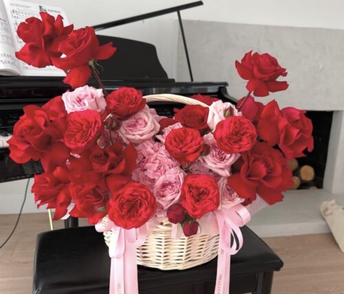 Basket of red and light pink roses