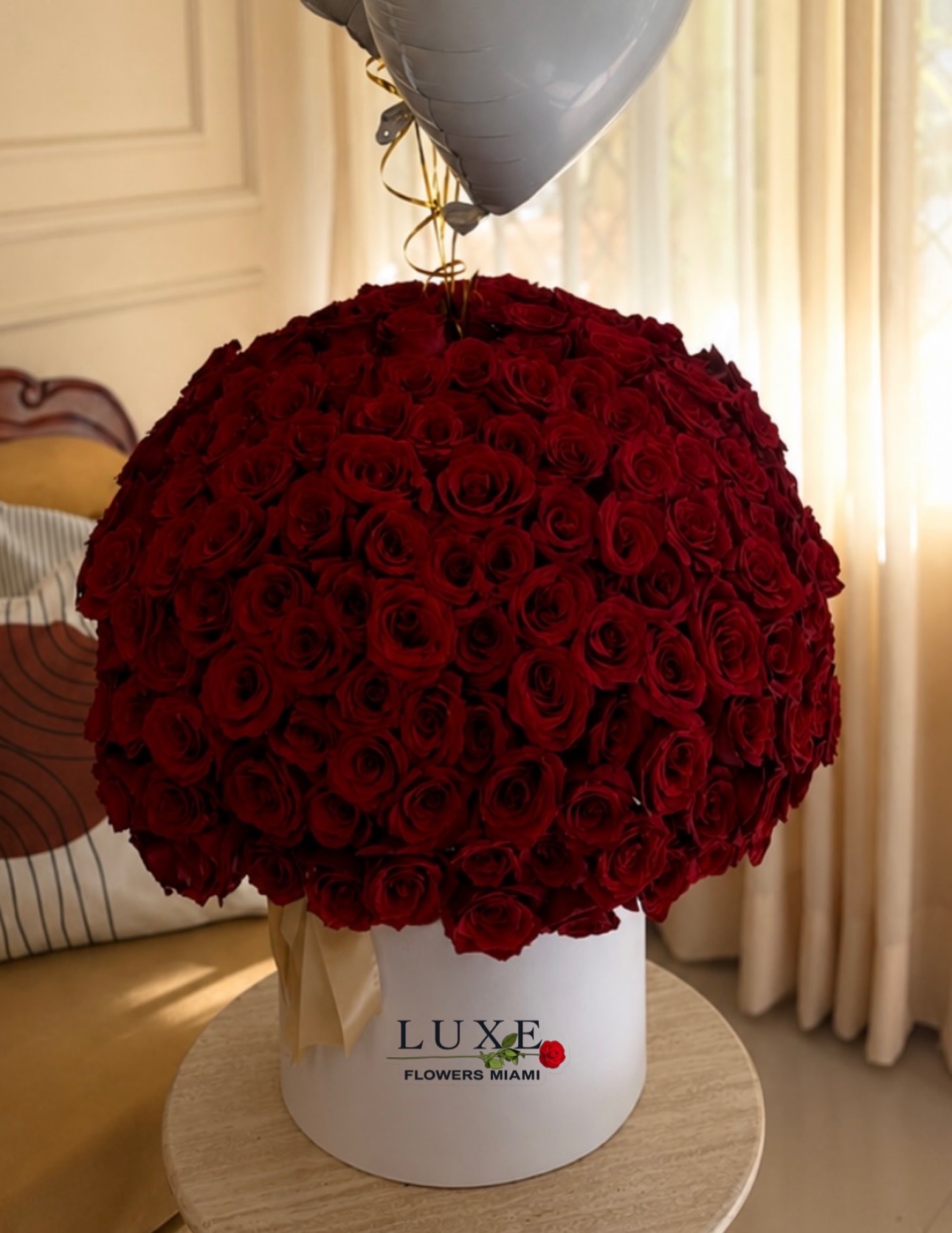Arrangement of 75 red roses in a box . Premium